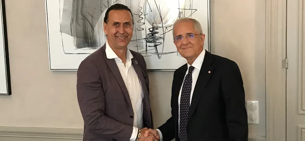 Promotional image showing NorthStar and Telespazio executives shaking hands to announce an SSA partnership for Europe.