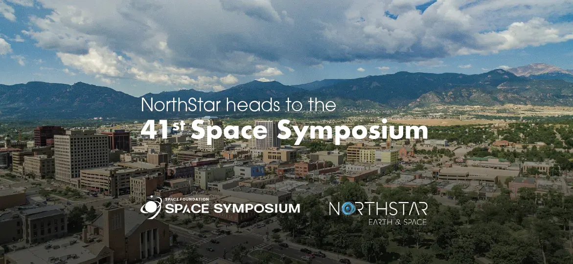 Aerial view of a city with mountains in the background and text announcing NorthStar’s attendance at the 41st Space Symposium