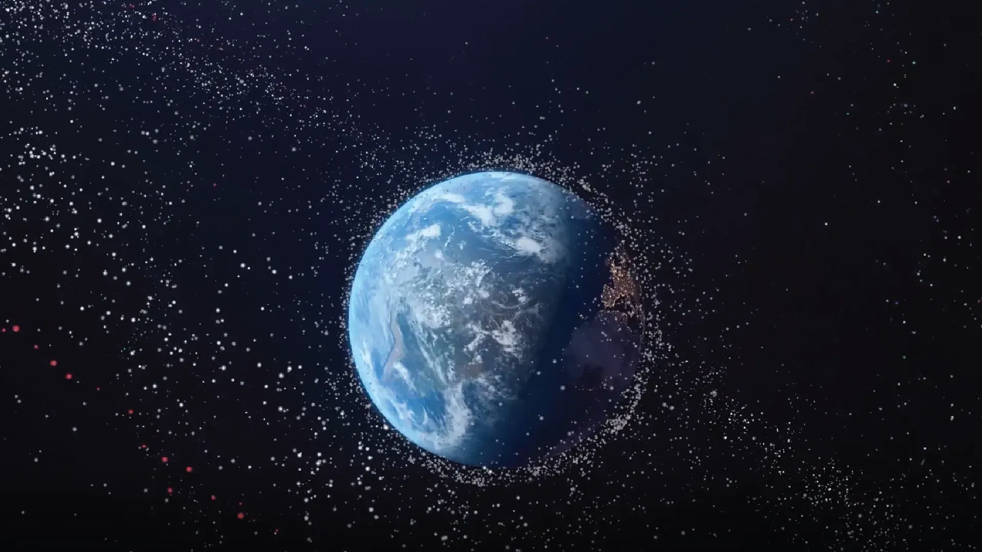 Earth surrounded by a dense cloud of orbiting debris and objects against a dark space background